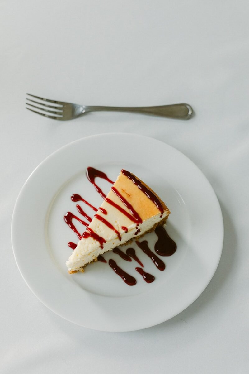 a piece of cheesecake on a plate with a fork